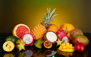 Fototapeta na wymiar Composition of exotic fruits on colorful background
