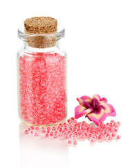 Little bottle full with colorful beads isolated on white