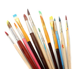 Many brush in paint isolated on white