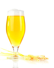 Glass of beer with spike lets on light yellow background