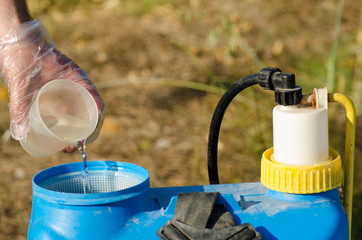 Adding pesticide