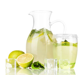 Lemonade in pitcher and glass isolated on white