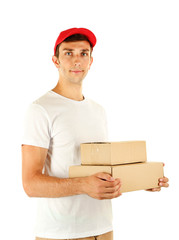 Young delivery man holding parcels, isolated on white