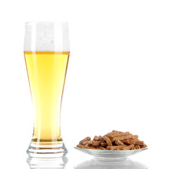 Beer in glass and croutons isolated on white