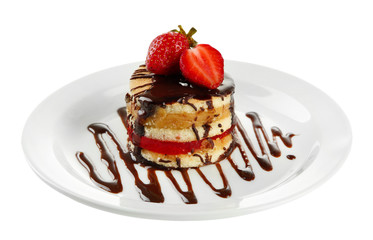 Tasty biscuit cake with chocolate and berries