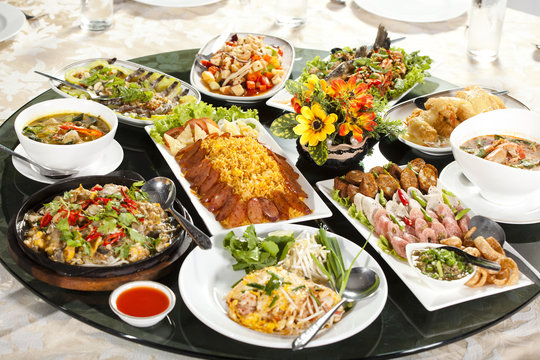 Fototapeta meal time, many kind of food dish put on round table