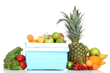 Fresh fruits and vegetables in mini refrigerator, isolated