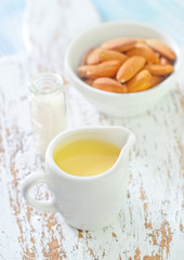 almond essential oil and almond in bowl