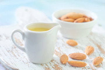 almond essential oil and almond in bowl