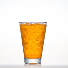Orange flavor drinks with sparkling soda ice in glass isolated