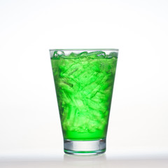 Green fruit flavor soft drinks whit soda water isolated