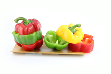 Slice the Three color of bell pepper in the Bamboo dish.