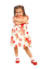 Little girl posing in dress with flowers