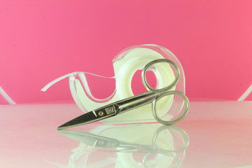 Obraz premium transparent tape with scissors