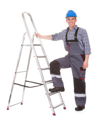 Portrait Of Male Worker With Ladder