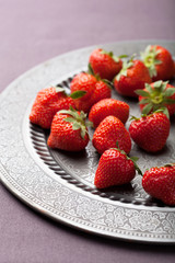strawberry on vintage plate