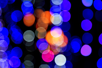 Defocused light bulbs at night as background