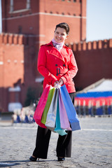 Fototapeta premium Young woman with shopping bags