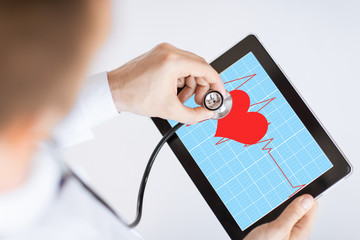 doctor listening to heart beat