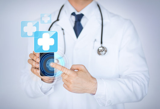 Doctor Holding Smartphone With Medical App