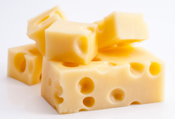 Emmental cheese portions on white base - obrazy, fototapety, plakaty