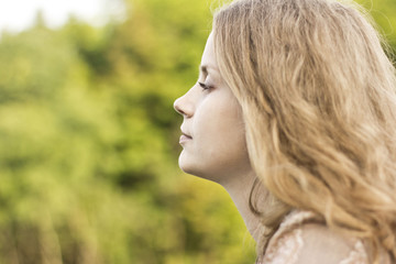 Profile serene girl with blond hair