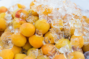 Fresh natural ripe apricots with ice cubes