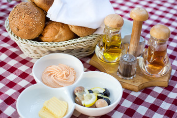 Breakfast with  olive, butter and bread
