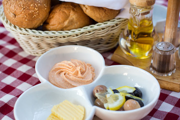 Breakfast with  olive, butter and bread