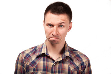 Obraz premium Man in a plaid shirt with funny face expressions