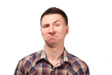 Obraz premium Man in a plaid shirt with funny face expressions