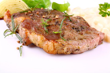 Herb Grilled steak meat with potato salad, onion and basil