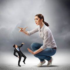 Businesswoman puppeteer