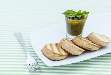 Grill bread with olive tapenade.