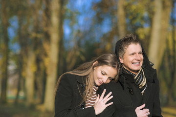 yuong caucasian couple walking in the park