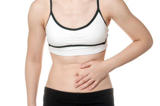 woman stomach ache in Sports wear isolated on white background