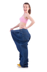 Woman in dieting concept with big jeans