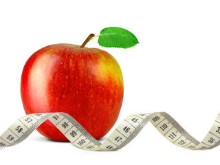 red apple with measuring tape isolated on white