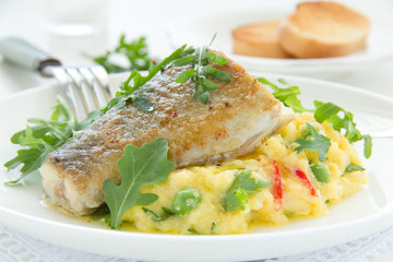 Grilled trout with couscous and vegetables.