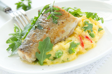 Grilled trout with couscous and vegetables.