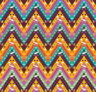 Seamless colorful aztec geometric  pattern with birds and arrows