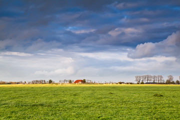 charming house on farmland at storm