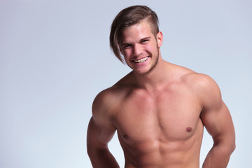 Fototapeta premium topless young man shows a big smile