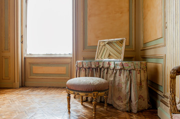 Luxury baroque interior with miror and chair
