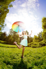 Happiness young woman with rainbow umbrella