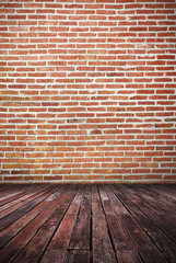 interior with dirty dark brick wall and wooden floor