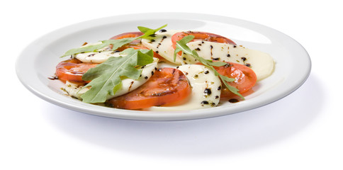 Salad served on white plate.