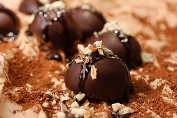 Chocolate candies with nuts, close up