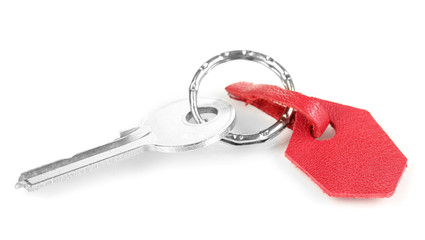 Key with leather trinket isolated on white