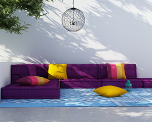 Luxury outdoor summer lounge space with sofa and cushions
